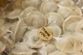 Frozen homemade dumplings in vacuum packaging and tag