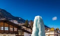 Frozen ice fountain in snowy alpine village Royalty Free Stock Photo