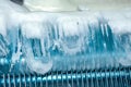Frozen ice on refrigerator grill Royalty Free Stock Photo