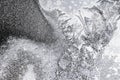 Frozen iced background. Ice pattern on the glass. Macro frost turn into negative black white photo