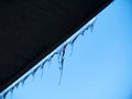 A frozen icicle of ice against a blue sky Royalty Free Stock Photo