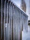 Frozen icicles hanging from the roof of a house Royalty Free Stock Photo