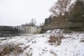 Winter landscape with frozen Jagala waterfall with icicles hanging from rocks, Estonia Royalty Free Stock Photo