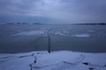 Frozen Lake. Beautiful stratus clouds over the ice surface on a frosty day. Natural background Royalty Free Stock Photo