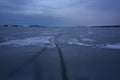 Frozen Lake. Beautiful stratus clouds over the ice surface on a frosty day. Natural background Royalty Free Stock Photo