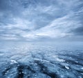 Frozen lake and dramatic sky