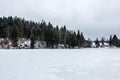 Frozen lake with ice and snow in winter Royalty Free Stock Photo