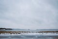 A frozen lake with islands. Rural winter landscape, Finland Royalty Free Stock Photo