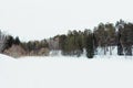 Frozen lake in the middle of beautiful winter forest. Winter landscape Royalty Free Stock Photo