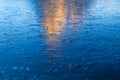 A frozen lake and reflections on the surface. Mountains during dawn. Abstract background. Detail in nature.