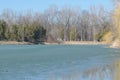 Frozen lake in spring time at Memorial Park Constantin Stere in Bucov, near Ploiesti, Romania Royalty Free Stock Photo