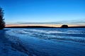 Frozen lake and sunset