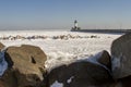 Lighthouse on frozen rocky shores of Lake Superior waterfront, Royalty Free Stock Photo