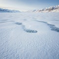 Frozen Lake Winter Landscape with Ice Patterns and Mountains Royalty Free Stock Photo