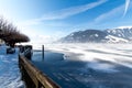 Frozen lake Zeller and snowy mountains in Austria Royalty Free Stock Photo