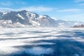 Frozen lake Zeller and snowy mountains in Austria Royalty Free Stock Photo