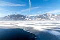 Frozen lake Zeller and snowy mountains in Austria Royalty Free Stock Photo
