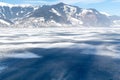 Frozen lake Zeller and snowy mountains in Austria Royalty Free Stock Photo