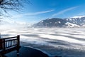 Frozen lake Zeller and snowy mountains in Austria Royalty Free Stock Photo