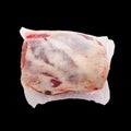 Frozen Lamb leg in package on black