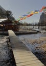 Frozen madhuri lake or sangestar tso lake and beautiful countryside view with buddhist prayer flags Royalty Free Stock Photo