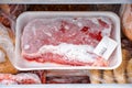 Frozen meat and other foods in the fridge freezer compartment Royalty Free Stock Photo