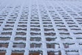 Frozen metal iron net chequer covered with frost in winter Royalty Free Stock Photo