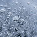 Frozen methane bubbles trapped in ice create a mesmerizing pattern on a greyish- Royalty Free Stock Photo
