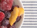 Frozen mixed fruit in a bowl on a tablecloth