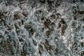 Frozen motion rapid stream water splashes nature background and texture. Short exposure close up view