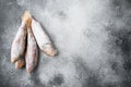 Frozen mullet or sultanka fish, on gray stone table background, top view flat lay , with copy space for text Royalty Free Stock Photo