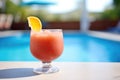 frozen negroni slush in stemless wine glass, poolside Royalty Free Stock Photo