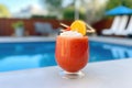 frozen negroni slush in stemless wine glass, poolside Royalty Free Stock Photo