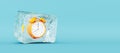Frozen orange clock, stopping the time concept on blue background Royalty Free Stock Photo