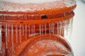 Frozen orange Fire Hydrant after an ice storm