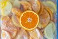 Frozen orange lemon in fridge bag