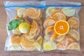 Frozen orange lemon in fridge bag