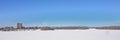 Frozen Ottawa river, with forest and skyscrapers on the embankment on uebec side