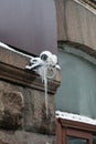 Frozen outdoor security camera on a building covered with ice
