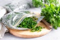 Frozen parsley in a plastic bag. Frozen vegetables