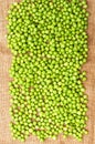 Frozen peas on a table. Pea pods on green background Royalty Free Stock Photo