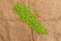 Frozen peas on a table. Pea pods on green background Royalty Free Stock Photo