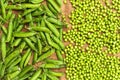 Frozen peas on a table. Pea pods on green background Royalty Free Stock Photo