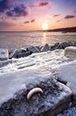 Frozen pier in the sunset