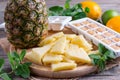 Frozen pineapple slices on a cutting board Royalty Free Stock Photo