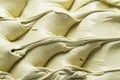 Frozen Pistachio flavour gelato - full frame detail. Close up of a creamy pastel green surface texture of Ice cream