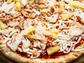 Frozen pizza with chicken and pineapple pieces Royalty Free Stock Photo
