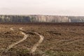 Frozen plowed field in autumn