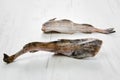 Frozen pollock carcass on wooden table Royalty Free Stock Photo