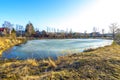 Frozen pond spring day in the village Royalty Free Stock Photo